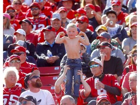 A young Calgary Stampeders fan flexes   as the Stamps beat the Edmonton Eskimos in the Labour Day classic at McMahon stadium in Calgary on Monday, September 2, 2019. Darren Makowichuk/Postmedia