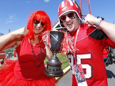 Stamp fans, L-R, Mackenzie -Lee Bussey and Ali Sampson cheer on their team during the tailgate party at McMahon stadium in Calgary on Monday, September 2, 2019. Darren Makowichuk/Postmedia