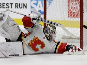 Calgary Flames goalie Cam Talbot makes a sprawling save during the first period against the San Jose Sharks during a pre-season game on Thursday, Sept. 26, 2019.