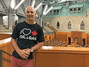 William Lacey was told his "I love Canadian oil" shirt couldn't be worn during a Senate tour.
