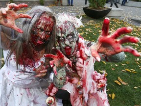 Beverley Harvey and Alexandra Friesen get some pictures during Calgary's Zombie Walk in 2017. Darren Makowichuk/Postmedia