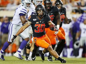 Running back Chuba Hubbard of the Oklahoma State Cowboys breaks free from the Kansas State Cowboys in the second quarter on Sept. 28 at Boone Pickens Stadium in Stillwater, Okla. Hubbard had 296 yards in OSU's 26-13 win. Photo by Brian Bahr/GETTY IMAGES.
