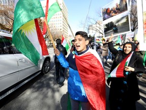 Hundreds of people from Calgary's Kurdish community and their supporters came out to rally Saturday at city hall against Turkey's military intervention in northern Syria. Darren Makowichuk/Postmedia