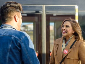 Nirmala Naidoo, Liberal candidate for Calgary Skyview, greets people at Saddletowne CTrain station Monday, Oct. 21, 2019. Conservative Jag Sahota won the riding.