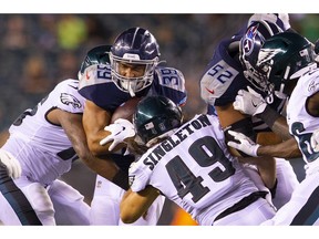 Tennessee Titans ball-carrier Alex Barnes runs the ball against Alex Singleton and the Philadelphia Eagles in this preseason game at Lincoln Financial Field on Aug. 8 in Philly.