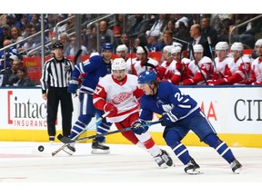 Red Wings winger Taro Hirose chases down Maple Leafs counterpart  Kasperi Kapanen during an NHL pre-season game at Scotiabank Arena on Sept. 28 in Toronto.