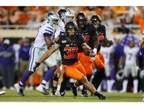 Running back Chuba Hubbard #30 of the Oklahoma State Cowboys breaks free from the Kansas State Cowboys in the second quarter on Sept. 28 at Boone Pickens Stadium in Stillwater, Okla.