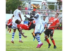 Cavalry FC Dominique Malonga goes up for a ball in the box late in the first half during Canadian Championship soccer action between the Montreal Impact and Cavalry FC at ATCO Field at Spruce Meadows in Calgary onWednesday, August 14, 2019. Jim Wells/Postmedia