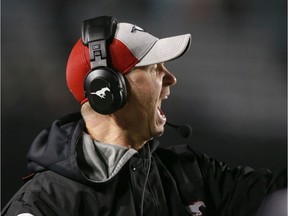 Stamps coach Dave Dickenson barks a the referees following a couple big penalties in the second quarter during CFL action between the Saskatchewan Roughriders and the Calgary Stampeders in Calgary on Friday, October 11, 2019. Jim Wells/Postmedia