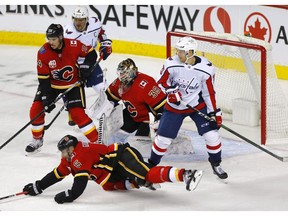 Calgary Flames goalie, Cam Talbot was busy in the crease against the Washington Capitals in third period NHL action at the Scotiabank Saddledome in Calgary on Tuesday, October 22, 2019. Darren Makowichuk/Postmedia