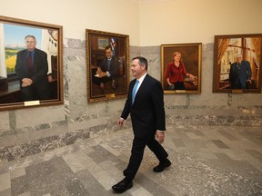 Alberta Premier Jason Kenney walks past portraits of former conservative premiers, prior to delivering the provincial budget Thursday October 24, 2019.