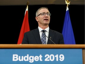 Alberta Finance Minister Travis Toews addresses the 2019 budget at a news conference in Edmonton on Thursday, Oct. 24, 2019.