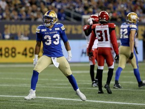 The Calgary Stampeders had their hands full trying to contain Blue Bombers running back Andrew Harris on Aug. 8, 2019.