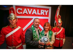 The commissioner of the Canadian Premier League, David Clanachan and Linda Southern-Heathcott, CEO of Spruce Meadows Sports & Entertainment Group, after revealing the team colours and crest of Calgary's new soccer club called Cavalry FC on Thursday, May 17, 2018  at Spruce Meadows.Al Charest/Postmedia