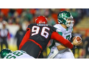 Saskatchewan Roughriders quarterback Cody Fajardor is sacked by Chris Casher of the Calgary Stampeders during CFL football in Calgary on Friday, October 11, 2019. Al Charest/Postmedia