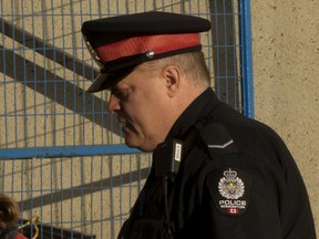 Const. Mike Chernyk arrives at the Edmonton Law Courts for the Abdulahi Hasan Sharif trial on Thursday, Oct. 3, 2019.