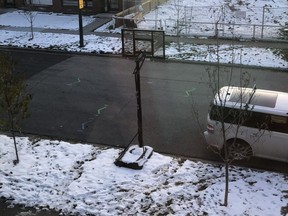 Calgary woman Ali McMillan received an order from city bylaw officers to remove a basketball net from next to a public road that's used by her children and neighbourhood kids, or have it impounded. Supplied photo/Postmedia Calgary