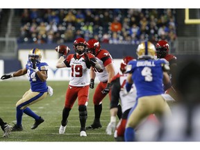 CP-Web.  Calgary Stampeders quarterback Bo Levi Mitchell (19) throws against the Winnipeg Blue Bombers during the first half of CFL action in Winnipeg Friday, October 25, 2019.