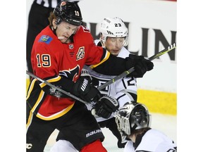 Calgary Flames Matthew Tkachuk battles against Dustin Brown of the Los Angeles Kings during NHL hockey at the Scotiabank Saddledome in Calgary on Monday, March 25, 2019. Al Charest/Postmedia