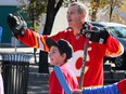 Flames alumni Craig Conroy joins current and past Grade 6 students in a street hockey game to celebrate the Flames Foundation's $1-million donation to YMCA Grade 6 program in Eau Claire on Friday, Oct. 11, 2019.