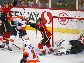 Calgary Flames' Johnny Gaudreau scores in overtime against the Philadelphia Flyers at Scotiabank Saddledome on Dec. 12, 2018.
