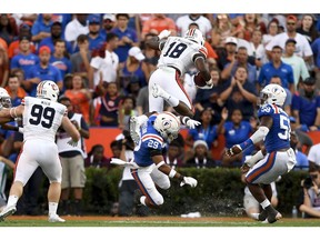 Oct 5, 2019; Gainesville, FL, USA; Auburn Tigers wide receiver Seth Williams (18) runs the ball as Florida Gators defensive back Jeawon Taylor (29) defends during the third quarter at Ben Hill Griffin Stadium. Mandatory Credit: Douglas DeFelice-USA TODAY Sports ORG XMIT: USATSI-404126