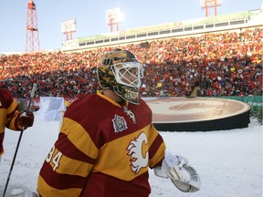 Miikka Kiprusoff of the Calgary Flames walks to the dressing room after the first period at McMahon Stadium in Calgary on Sunday February 20, 2011. The Flames were facing the Habs as the marquee event in the Heritage Classic outdoor-hockey weekend. LYLE ASPINALL/CALGARY SUN/QMI AGENCY