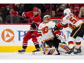 Oct 29, 2019; Raleigh, NC, USA; Carolina Hurricanes right wing Andrei Svechnikov (37) scores a third period goal against Calgary Flames goaltender David Rittich (33) at PNC Arena. Mandatory Credit: James Guillory-USA TODAY Sports ORG XMIT: USATSI-405176