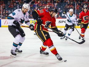 Sep 18, 2019; Calgary, Alberta, CAN; Calgary Flames center Alan Quine (89) controls the puck against the San Jose Sharks during the first period at Scotiabank Saddledome. Mandatory Credit: Sergei Belski-USA TODAY Sports ORG XMIT: USATSI-406631