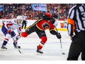 Oct 22, 2019; Calgary, Alberta, CAN; Calgary Flames center Tobias Rieder (16) shoots the puck against the Washington Capitals during the first period at Scotiabank Saddledome. Mandatory Credit: Sergei Belski-USA TODAY Sports ORG XMIT: USATSI-405135