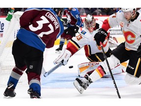 Colorado Avalanche left wing J.T. Compher (37) scores past Calgary Flames goaltender David Rittich (33) in the second period at the Pepsi Center. Photo by Ron Chenoy/USA TODAY Sports.