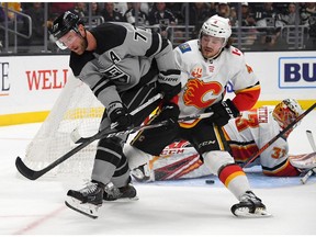 Oct 19, 2019; Los Angeles, CA, USA; Calgary Flames goaltender David Rittich (33) blocks a shot by Los Angeles Kings center Jeff Carter (77) as Calgary defenseman Rasmus Andersson (4) assists in the second period at Staples Center. Mandatory Credit: Jayne Kamin-Oncea-USA TODAY Sports ORG XMIT: USATSI-405115