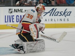 Calgary Flames goaltender Cam Talbot makes a save against the San Jose Sharks during the second period at SAP Center at San Jose on Sunday, Oct. 13, 2019.