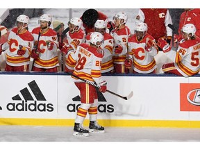 Oct 26, 2019; Regina, Saskatchewan, CAN; Calgary Flames center Elias Lindholm (28) celebrates his second period goal against the Winnipeg Jets during the 2019 Heritage Classic outdoor hockey game at Mosaic Stadium. Mandatory Credit: Candice Ward-USA TODAY Sports ORG XMIT: USATSI-405162