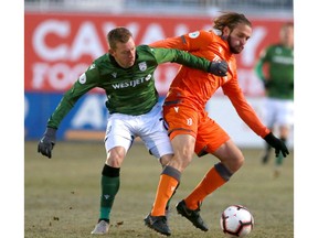 Cavalry FC Oliver Minatel (L) challenges Forge FC Giuliano Frano during CPL soccer action between Forge FC and Cavalry FC at ATCO Field at Spruce Meadows in Calgary on Wednesday, October 9, 2019. Jim Wells/Postmedia