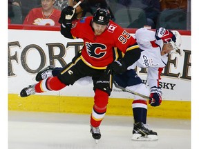 The Calgary Flames' Sam Bennett collides with the Washington Capitals' T.J. Oshie during NHL action at the Scotiabank Saddledome in Calgary on Saturday October 27, 2018.  Gavin Young/Postmedia