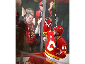 Elias Lindholm celebrates his first period goal and the team's first goal of the season during NHL action between the Vancouver Canucks and the Calgary Flames in Calgary on Saturday, October 5, 2019. Jim Wells/Postmedia