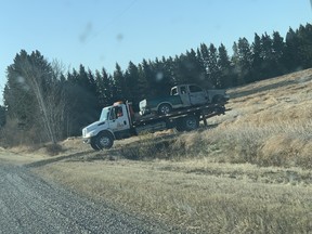 A truck associated with an assault and robbery is removed near Eckville on Wednesday, Oct. 23, 2019.