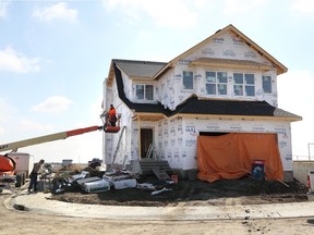 May 06 2019 Calgary AB - Construction workers on a single family unit in Mahogany - (Wil Andruschak/Calgary Herald)