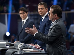 Liberal leader Justin Trudeau, left to right, Conservative leader Andrew Scheer and Bloc Quebecois leader Yves-Francois Blanchet take part in the leaders’ French language debate in Gatineau, Que. on Thursday, October 10, 2019. (THE CANADIAN PRESS/Chris Wattie)