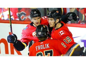 Calgary Flames Matthew Tkachuk celebrates with teammates after his goal against the Florida Panthers during NHL hockey in Calgary on Thursday October 24, 2019. Al Charest / Postmedia