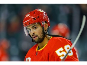 Calgary Flames Oliver Kylington during warm-up before facing the Detroit Red Wings during NHL hockey in Calgary on Thursday October 17, 2019. Al Charest / Postmedia