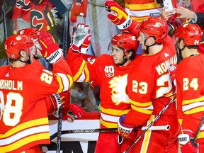 Calgary Flames Sean Monahan celebrates with teammates after his goal against the Vancouver Canucks during NHL hockey in Calgary on Saturday October 5, 2019. Al Charest / Postmedia