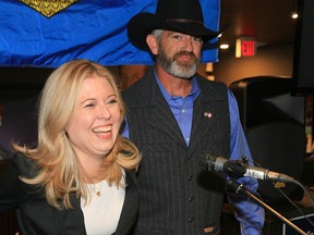Conservative candidate Michelle Rempel, with her husband Jeffrey Garner, is all smiles at her election headquarters in Harvest Hills on Monday, Oct. 21, 2019. Rempel was re-elected in Calgary Nose Hill.