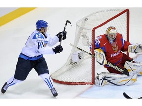 Finish hockey player Mikael Granlund scores a highlight-reel goal on Russian netminder Konstantin Barulin during the semifinal match of the World Hockey Championships in Bratislava, Slovakia, in this photo from May 2011.