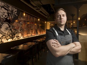 Owner and chef Darren MacLean poses for a photo inside Shokunin, his Japanese restaurant in downtown Calgary.