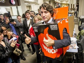 Justin Trudeau briefly wears a UNICEF Halloween costume handed to him while mingling with students at the University of Calgary in Calgary, Alta., on Wednesday October 30, 2013.