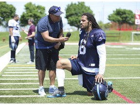 Toronto Argos Marcus Ball LB (6) takes a knee as he speaks with Toronto Sun CFL reporter Frank Zicarelli  during an interview after practice in Toronto, Ont. on Wednesday May 30, 2018. Jack Boland/Toronto Sun/Postmedia Network
