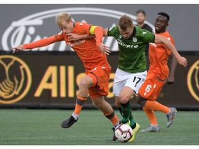 Oct 26, 2019; Hamilton, Ontario, CAN;  Forge FC midfielder Kyle Bekker (10) battles for the with Cavalry FC forward Nico Pasquatti (17) in the first half of a Canadian Premier League soccer final match at Tim Hortons Field. Mandatory Credit: Dan Hamilton-USA TODAY Sports for CPL ORG XMIT: USATSI-415705