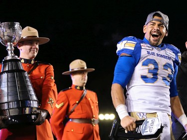 The Winnipeg Blue Bombers Andrew Harris celebrates his Grey Cup MVP after the Bombers defeated the Hamilton Tiger-Cats 33-12 at the 107th Grey Cup in Calgary Sunday, November 24, 2019. Gavin Young/Postmedia
